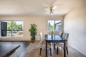 Edmonton apartment for rent - A dining room with a table and chairs.