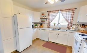 Edmonton apartment for rent - A room with wooden floors and a window.