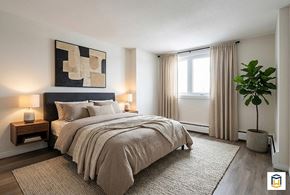Edmonton apartment for rent - A modern apartment building with a grassy area in front.