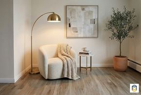 Edmonton apartment for rent - A spacious room with a carpeted floor and white walls.