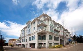 Burnaby apartment for rent - A large white building with a balcony on the second floor.