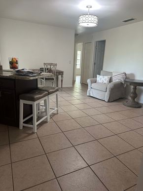 Deltona house for rent - A kitchen with a table and chairs.