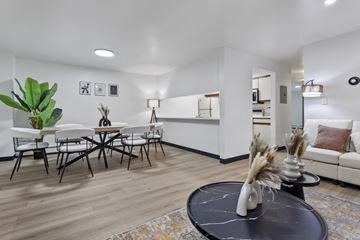 Altoona apartment for rent - A living room with a black coffee table and a white sofa.