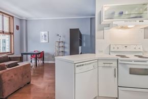Edmonton house for rent - A kitchen with a white oven and a white dishwasher.
