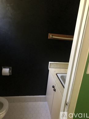 North Little Rock house for rent - A bathroom with a toilet and a sink.