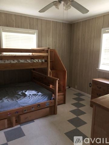 North Little Rock house for rent - A bedroom with a bunk bed and a dresser.