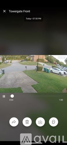 Atlanta townhouse for rent - A view of a parking lot with cars and a building in the background.