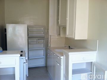 Los Angeles apartment for rent - A kitchen with white appliances and cabinets.