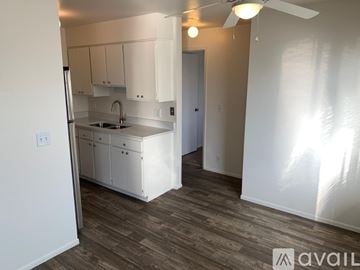 Midvale apartment for rent - A kitchen with white cabinets and a sink.