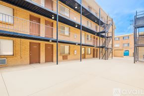 Aurora apartment for rent - A building with balconies and a staircase.
