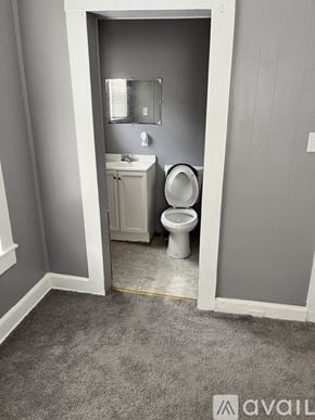 Brockton apartment for rent - A bathroom with a toilet and sink in a small space.