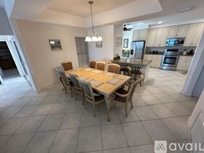 Melbourne Beach condo for rent - A dining room with a table set for six.