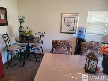 Bellevue apartment for rent - A living room with a couch, chair, table, and vase.