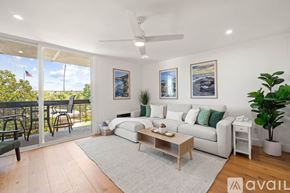 San Diego apartment for rent - A swimming pool surrounded by palm trees and lounge chairs.