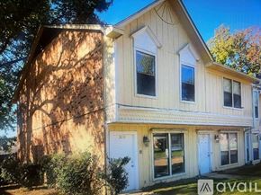 Texarkana apartment for rent - A house with a white door and windows is for sale.