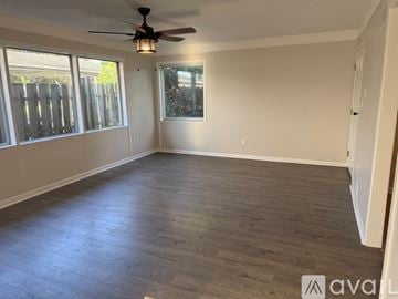 Taylor house for rent - A kitchen with wooden cabinets and stainless steel appliances.