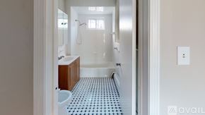 Somerville apartment for rent - A bathroom with a toilet, sink, and shower.