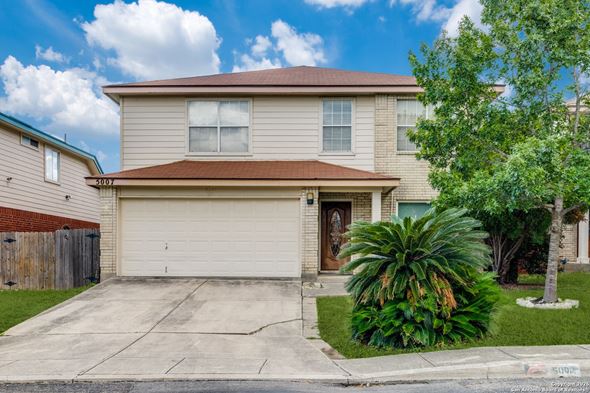 San Antonio house for rent - A house with a brown roof and a garage door.