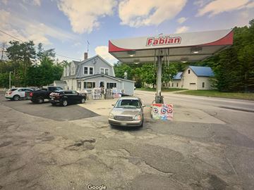 Turner apartment for rent - A car is parked in front of a Fabian gas station.