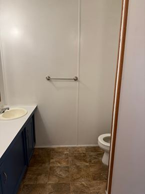 Interlachen house for rent - A bathroom with a toilet, sink, and shower.