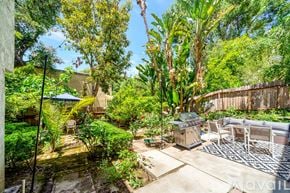 Los Angeles house for rent - A backyard with a patio and a pool table.