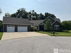 Terre Haute house for rent - A house with a grey roof and a white garage door.