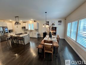 Terre Haute house for rent - A well-lit kitchen with a dining table set for two.