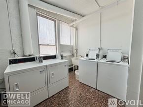 Chicago apartment for rent - A kitchen with white cabinets and a wooden floor.