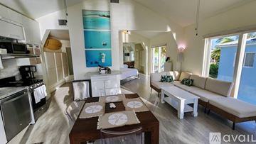 Big Pine Key house for rent - A kitchen with a dining table and a couch.
