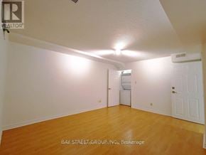Toronto (Rouge) house for rent - A room with a white ceiling and wooden floor.