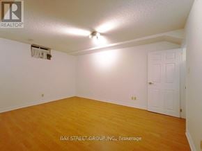 Toronto (Rouge) house for rent - A room with a white door and a ceiling fan.