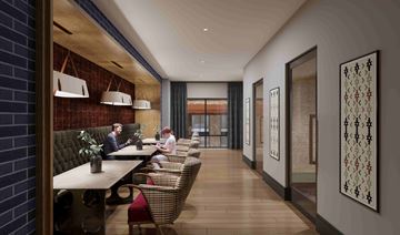 Nashville apartment for rent - A modern dining area with people seated at tables.