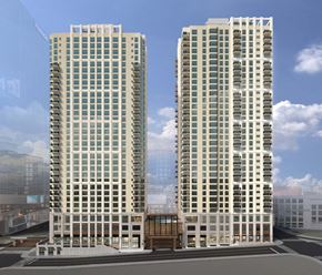 Nashville apartment for rent - Two modern high-rise buildings with balconies and a cloudy sky in the background.