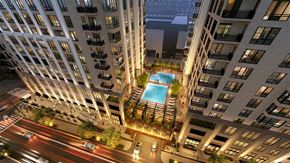 Nashville apartment for rent - Elevated pool deck at Nashville Yards with cabanas, lounge chairs, and city views.
