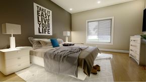 Luxemburg apartment for rent - A bedroom with a bed, nightstands, and a motivational poster on the wall.