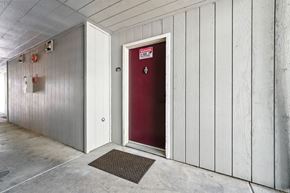 Vallejo apartment for rent - A red door is in a white building.