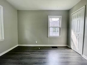 Louisville house for rent - A room with a window and a door.