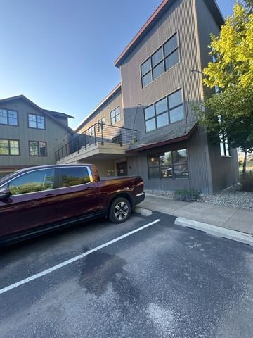 Whitefish apartment for rent - A red car is parked on the side of a street.