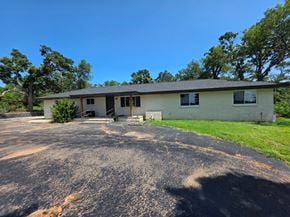 Harrah house for rent - A house with a driveway in front of it.