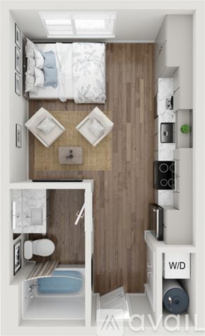Salt Lake City apartment for rent - A small bedroom with a bed, a chair, a table, and a toilet.