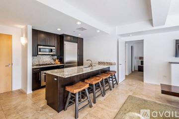 Scottsdale condo for rent - A kitchen with a bar stool and a counter top.