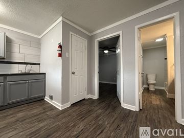 Seguin apartment for rent - A kitchen with a refrigerator, oven, and cabinets.