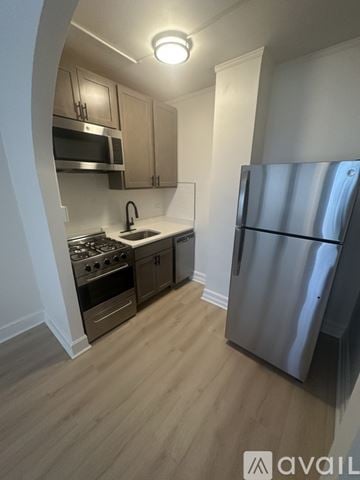 Hammond apartment for rent - A kitchen with a refrigerator, stove, and sink.