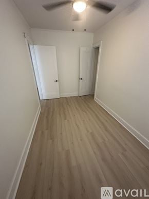 Hammond apartment for rent - A room with wooden flooring and two doors.