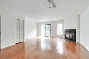Richmond house for rent - A room with a fireplace and a sliding glass door.