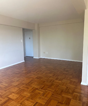 Washington apartment for rent - A room with a wooden floor and a door.