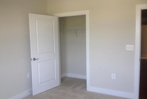 Baltimore house for rent - A white door is open to a room with a carpeted floor.