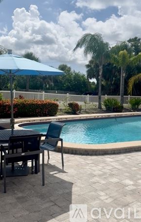 Tampa apartment for rent - A row of multi-story buildings with balconies and windows.