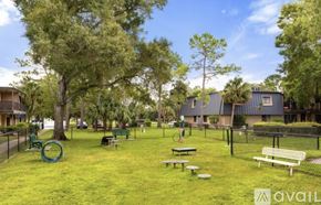 Tampa apartment for rent - A modern dining room with a table set for two and a view of the balcony.