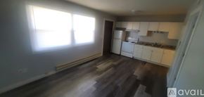 La Crosse apartment for rent - A kitchen with white cabinets and a window letting in sunlight.